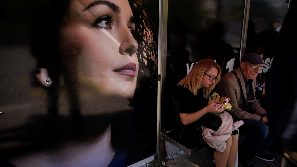 A poster of Vjosa Osmani, election candidate for prime minister from the opposition party Democratic League of Kosovo (LDK), on a bus stop in Pristina. Photograph: Armend Nimani/AFP