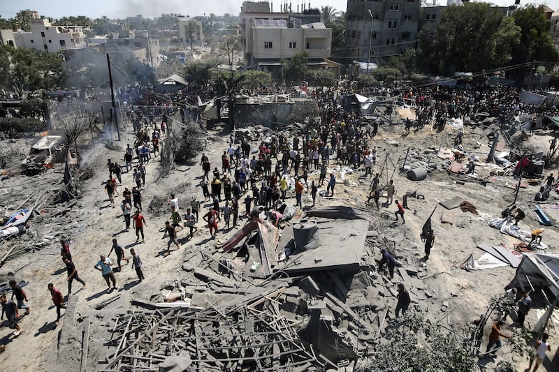 Palestinians inspect the scene after an Israeli raid on the Al-Mawasi area of Khan Younis. Photograph: Haitham Imad/EPA-EFE