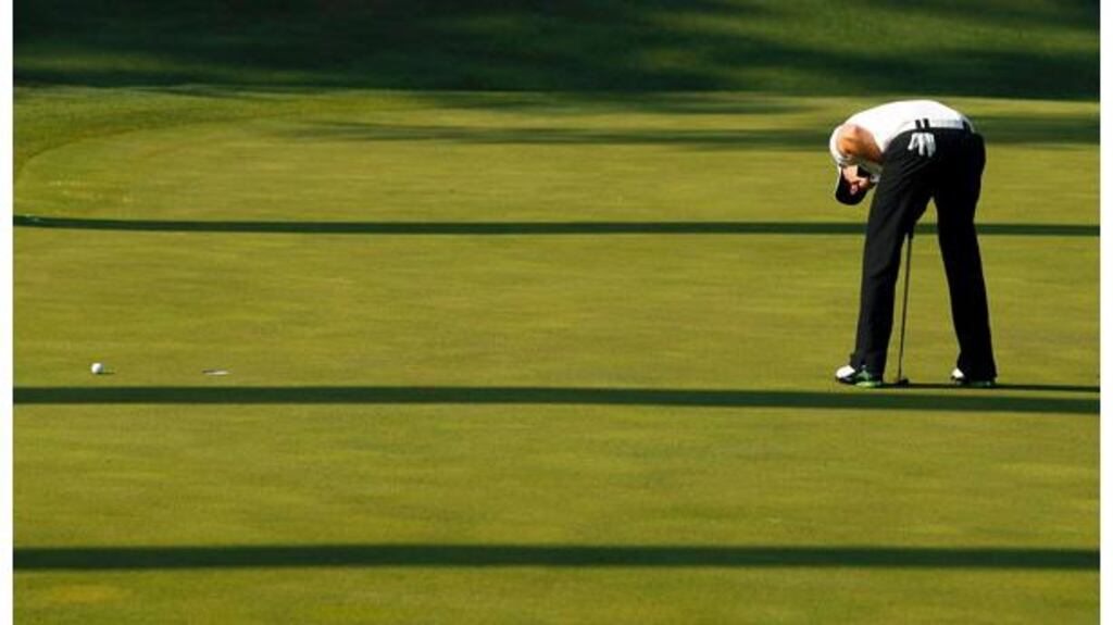 Rory McIlroy reacts as his par putt slides by on the 10th green. Despite the bogey the 21-year-old will take a four shot lead into the final round on Sunday. Photograph: Shaun Best/Reuters