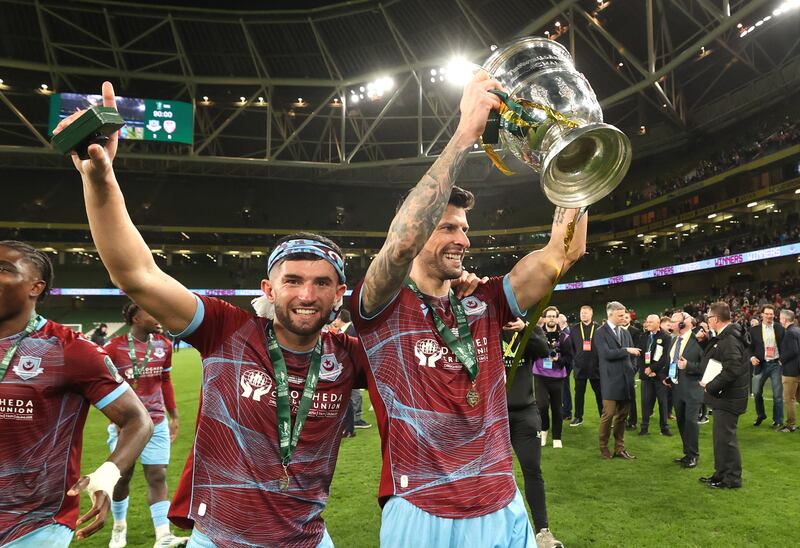 Drogheda United's Luke Heeney and Adam Foley celebrate winning the 2024 FAI Cup Final at the Aviva Stadium. Photograph: Bryan Keane/Inpho