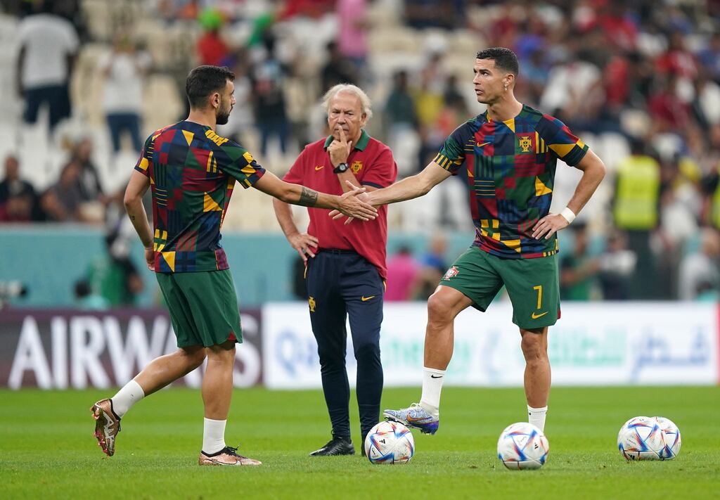 Portugal's Bruno Fernandes and Cristiano Ronaldo shake hands ahead of the World Cup Round of 16 match against Switzerland at the Lusail Stadium. Photograph: Mike Egerton/PA Wire