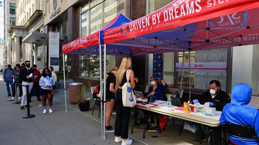 Students stand in line to get tested for Covid-19. Photograph: by Angela Weiss/AFP via Getty Images