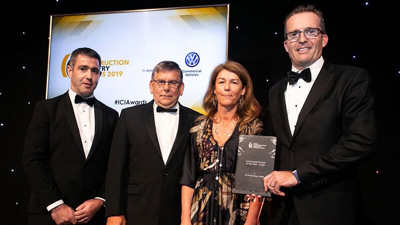 Laura Farrell, Account Manager, Diatec presents the Commercial Project of the Year – Large award to the Bennett (Construction) team.
