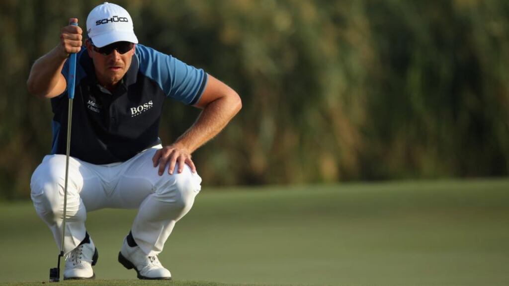 Henrik Stenson lines up a putt on the 17th green during the first round of the DP World Tour Championship. Photograph: Andrew Redington/Getty Images