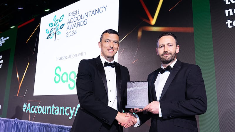 Patrick Ryan, business banking manager, ptsb, presents the tax team of the year award to Bryan Farell, Walsh OBrien Harnett.