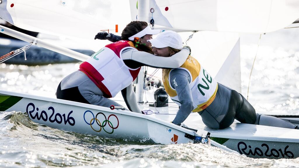 Ireland’s Olympic silver medalist Annalise Murphy (left) congratulates gold medal winner Marit Boumeester of Holland after the Laser Radial Medal race in Rio. Photo: World Sailing