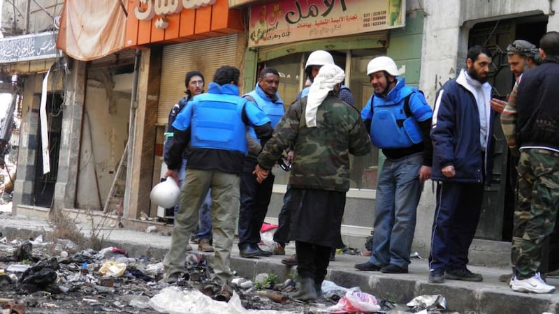 United Nations members arrive to the besieged neighbourhoods of Homs to supply humanitarian aid today. Photograph: Thaer Al Khalidiya/The Irish Times