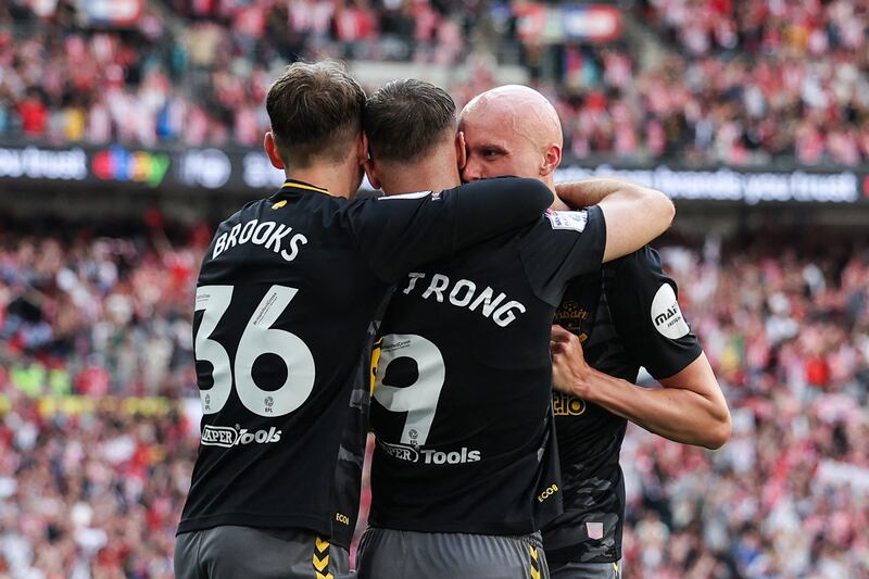 Will Smallbone celebrates with Southampton goalscorer Adam Armstrong and David Brooks during the Championship playoff final against Leeds United at Wembley Stadium. Photograph: Adrian Dennis/AFP via Getty Images