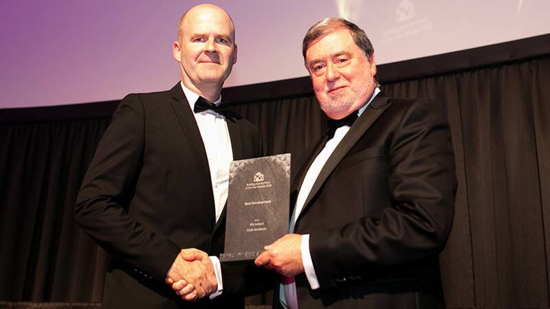 Derry Scully, Group President, Linesight presents the Best Development award to Dermot Harrington, Cook Architects.