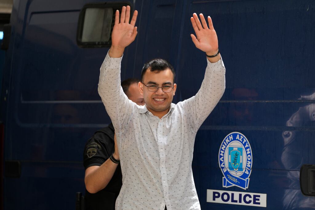 One of nine Egyptians who was on trial for people smuggling and causing a ship to sink leaves the court in Kalamata, Greece. Photograph: Thanassis Stavrakis/AP