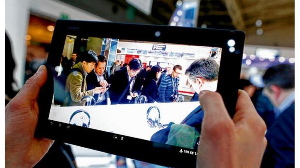 An employee demonstrates the video function of a Sony Xperia Tablet Z at the Mobile World Congress in Barcelona yesterday. photograph: Simon Dawson/Bloomberg