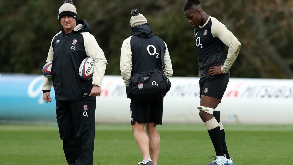 Maro Itoje with England physio Bob Stewart and Richard Hill, the team manager. Photograph: David Rogers/Getty Images
