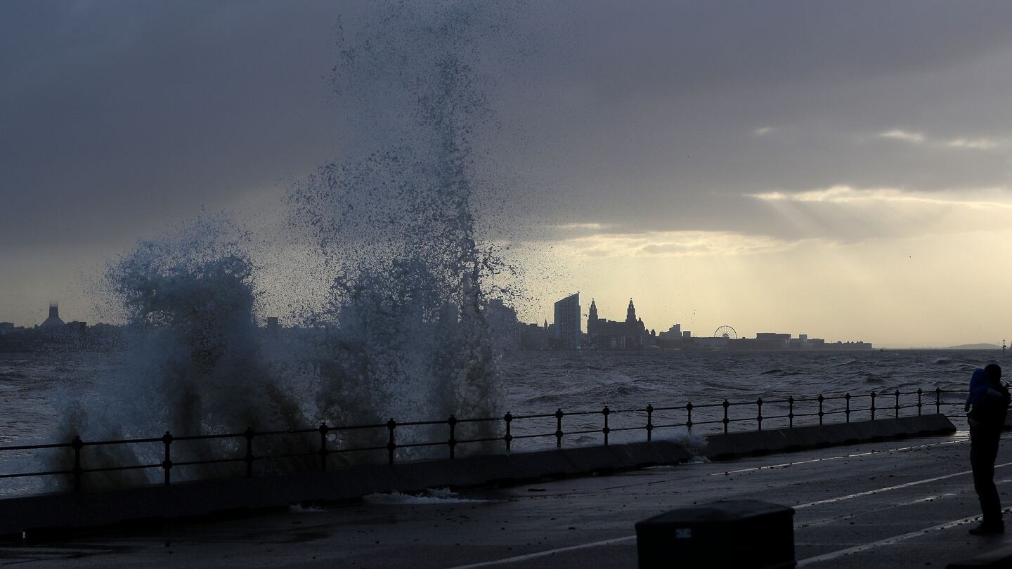 Waves crash over the promenade at New Brighton in Wirral, UK. Photograph: Peter Byrne/PA Wire