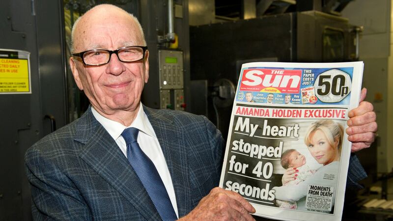 Rupert Murdoch reviews the first edition of The Sun On Sunday as it comes off the presses on February 25th, 2012 in Broxbourne, England. Photograph: Arthur Edwards/News International via Getty Images