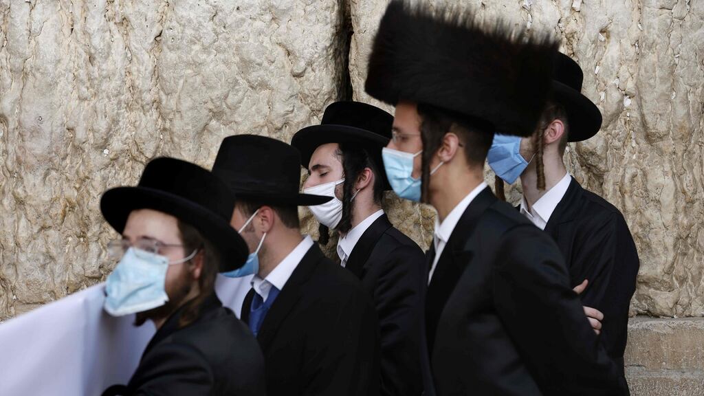 Ultra-Orthodox Jewish worshippers pray during the Sukkot festival, or the feast of the Tabernacles, at the Western Wall in the old city of Jerusalem, on Wednesday. Photograph: Menahem Kahana/AFP via Getty Images)