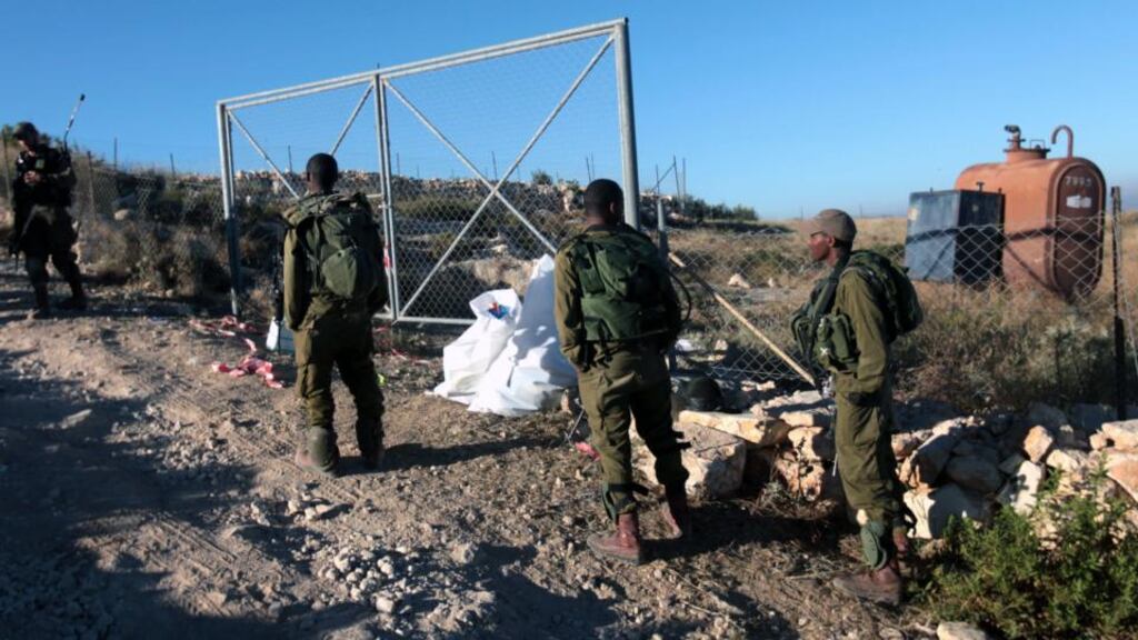 Israeli soldiers patrol in the hills in the West bank village of Halhoul, north of Hebron, yesterday near the place where the bodies of the three kidnapped Israeli teens were found. Photograph: Abed Al Hashlamoun/EPA