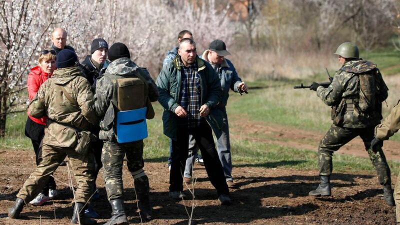 Ukrainian soldiers clash with pro-Russia protesters in a field near Kramatorsk, in eastern Ukraine. Photograph: Marko Djurica/Reuters