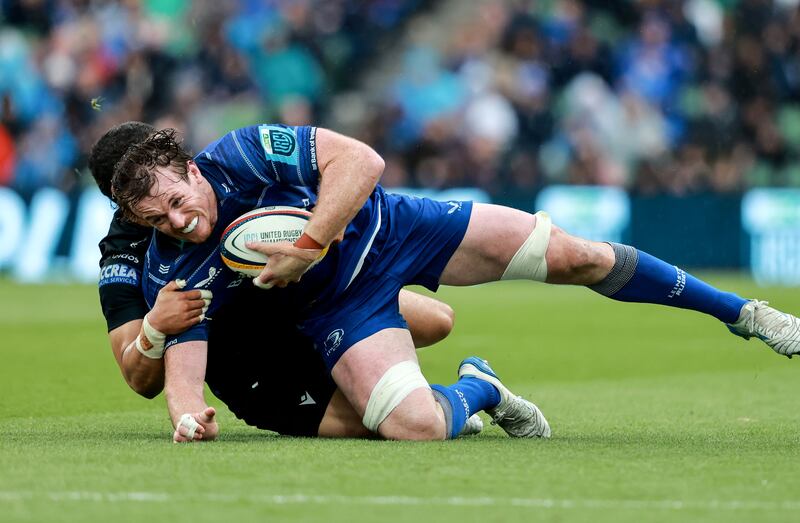 Leinster's Ryan Baird is tackled by Glasgow's Sione Tuipulotu. Photograph: Dan Sheridan/Inpho
