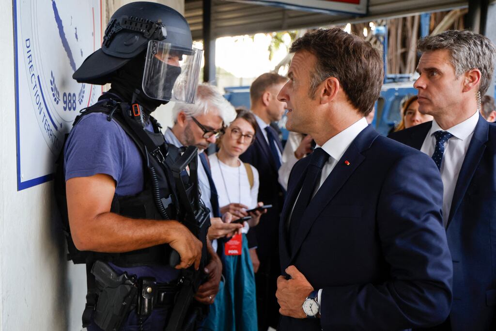 French president Emmanuel Macron arrives at the central police station in Noumea, France's Pacific territory of New Caledonia: Photograph: Ludovic Marin/AFP via Getty Images