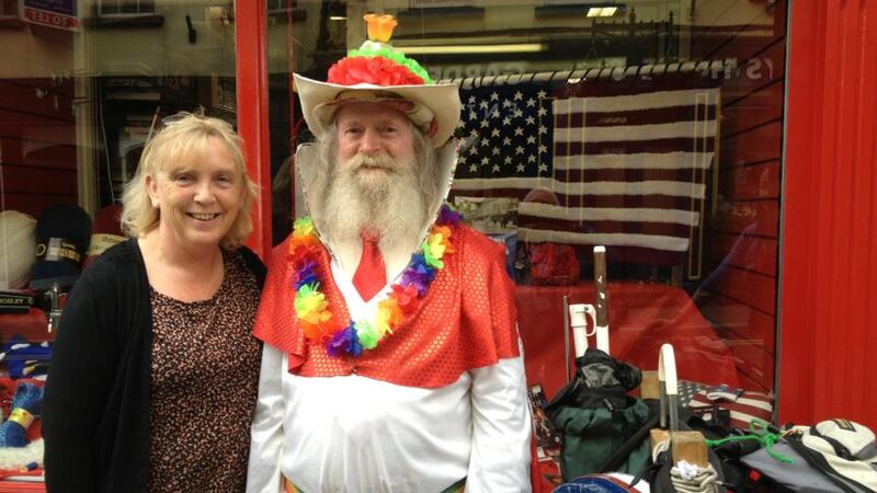 New Ross shop owner Mary Finn with street entertainer Kevin McCormack preparing for the Kennedy commemoration today. Photograph: Peter Murtagh