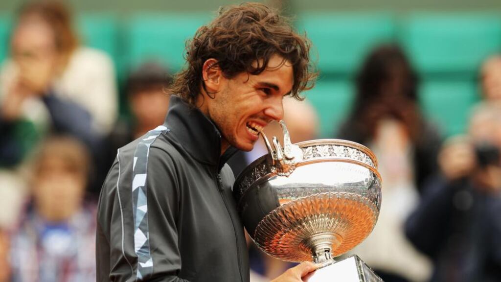 Rafael Nadal poses with trophy following his men's singles win over Novak Djokovic in last year's French Open. Photograph: Matthew Stockman/Getty Images