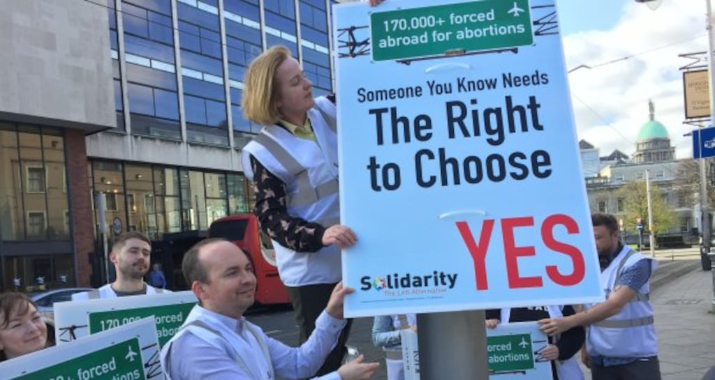 Members of Solidarity erecting the referendum poster in Dublin city centre last month.