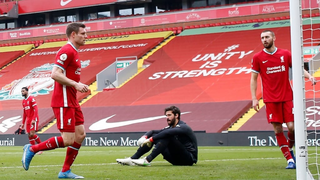 Alisson looks dejected after Mario Lemina scores for Fulham at Anfield. Photograph: Phil Noble/PA