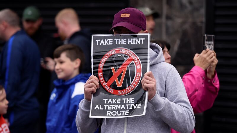 A member of the Greater Ardoyne Residents Coalition GARC expresses his opinion while waiting for the Twelfth of July Orange Order parade to come down the Crumlin Road in Belfast. Photograph: Clodagh Kilcoyne/Reuters