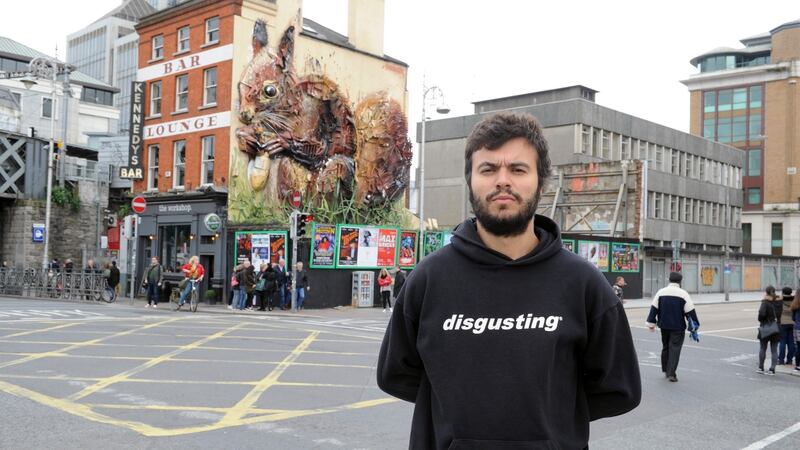 Artist Artur Bordalo picutred at Butt Bridge, Dublin infront of his art installation called Red Squirrel. Photograph: Aidan Crawley/The Irish Times