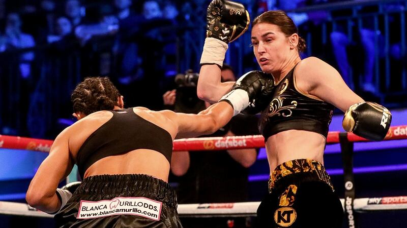 Taylor dodges a McCaskill punch. Photo: James Crombie/Inpho