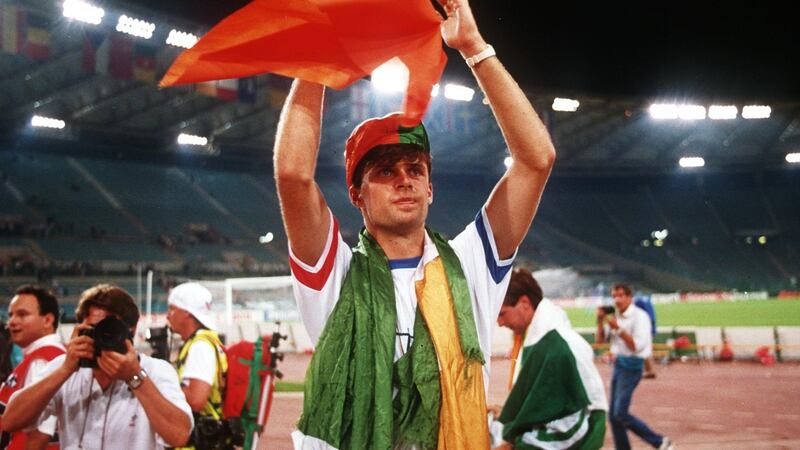 Niall Quinn applauds the Ireland fans after their defeat to Italy at Italia 90. Photograph: Billy Stickland/Inpho