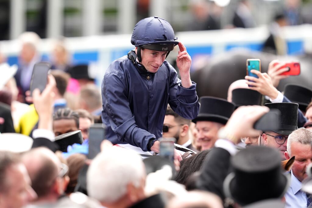 Jockey Ryan Moore celebrates after winning the Betfred Derby onboard City Of Troy. Photograph: Adam Davy/PA wire