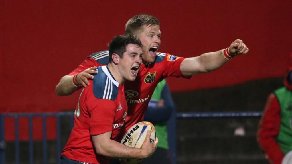 Munster’s Ronan O’Mahony scores the winning try and is congratulated by Ivan Dineen. Photograph: Billy Stickland/Inpho