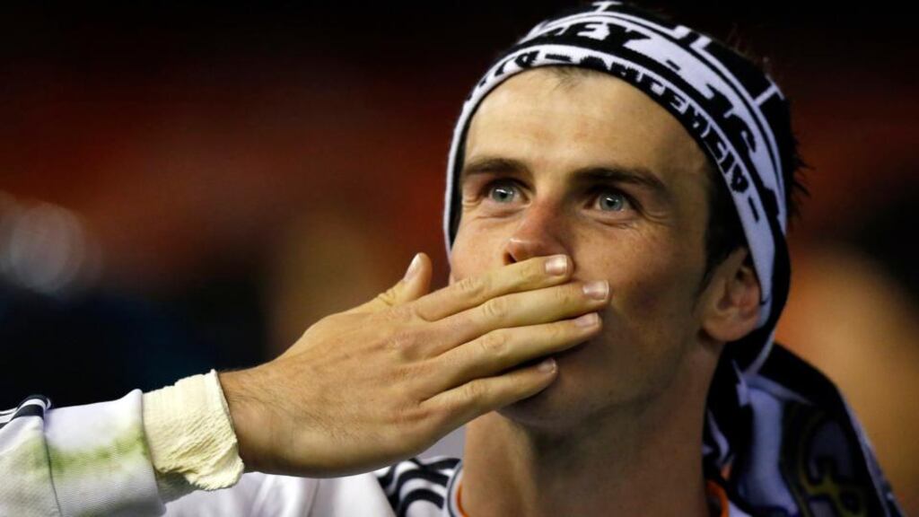Real Madrid’s Gareth Bale celebrates after winning the Copa del Rey, thanks to a 2-1 victory over Barcelona in which he scored a sublime winner. Photograph: Sergio Perez / Reuters