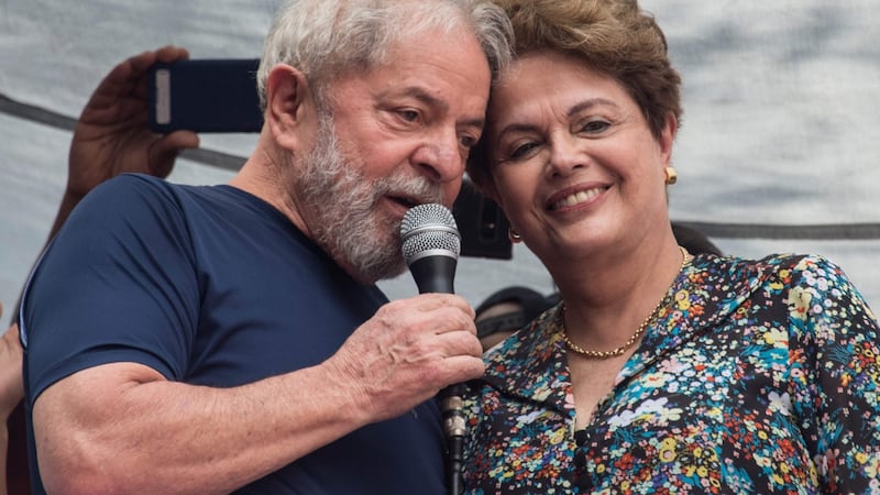 Luiz Inacio Lula da Silva speaks next to Brazilian former president Dilma Rousseff on Saturday. Photograph: Nelson Almeida/AFP/Getty Images