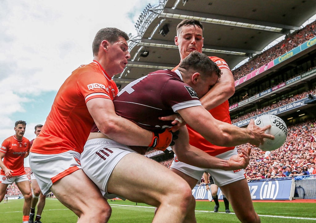 Galway's Damien Comer is challenged by Paddy Burns and Aaron McKay of Armagh during the All-Ireland SFC final at Croke Park. Photograph: Tom Maher/Inpho