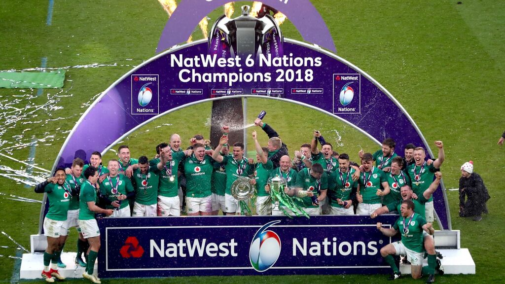Ireland celebrate after securing the Grand Slam at Twickenham. Photograph: James Crombie/Inpho
