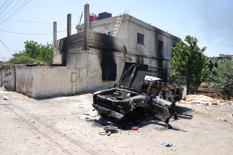A damaged car and house in the Sweida countryside, southern Syria, where fighters from Bedouin tribes continued to roam on Friday. Photograph: EPA