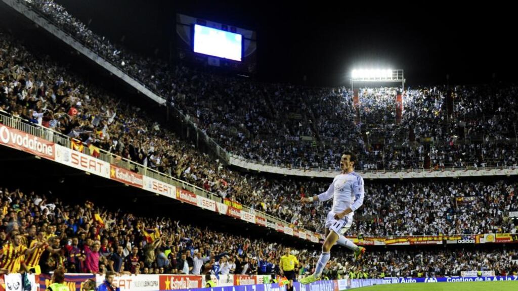 Gareth Bale celebrates after scoring a wonderful late goal to deliver Spanish Copa del Rey final for Real Madrid over great rivals Barcelona in Valencia. Dani Pozo/AFP/Getty Images