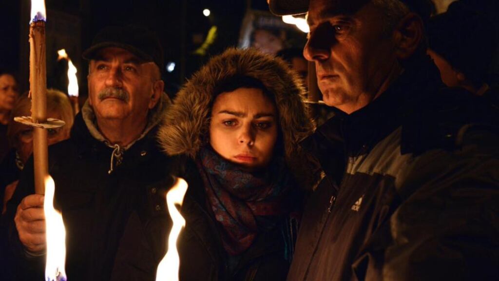 People take part in a torchlight procession on Saturday night for victims of the 2009 earthquake in L’Aquila. Photograph: EPA/Claudio Lattanzio
