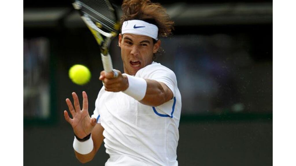 Spain's Rafael Nadal hits a return during his quarter-final win over Mardy Fish at Wimbledon. Photograph: Eddie Keogh/Reuters