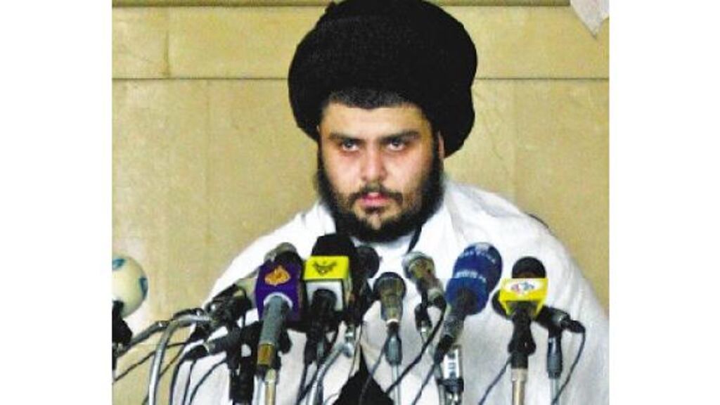 Shia cleric Moqtada al-Sadr addresses Friday prayers in the town of Kufa yesterday.