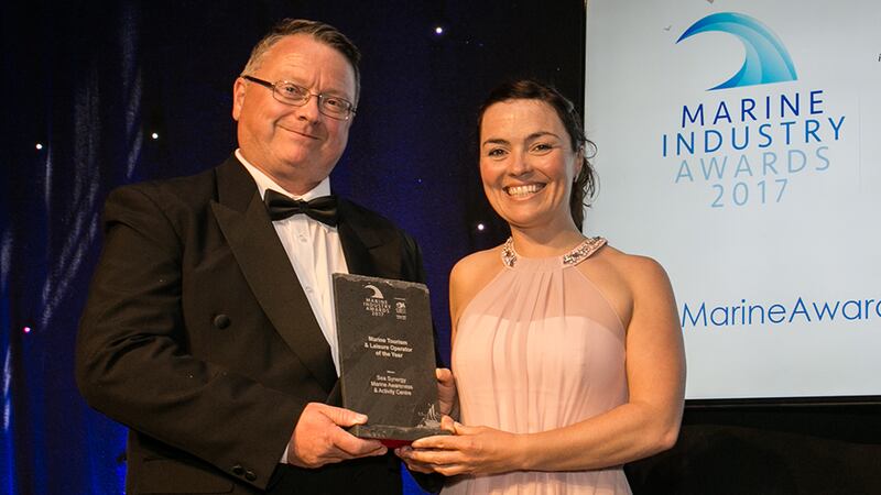 Rory Carberry, Director, Irish Sailing Association presents the Marine Tourism & Leisure Operator of the Year award to Lucy Hunt, Sea Synergy Marine Awareness & Activity Centre.