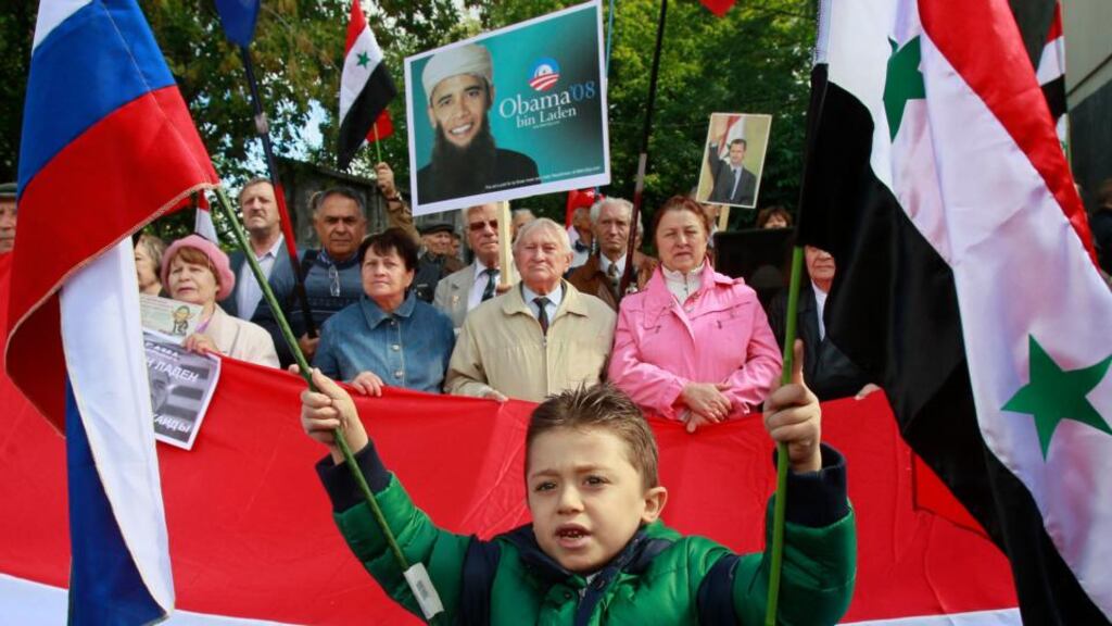 Activists take part in a rally to denounce US president Barack Obama’s proposed plan for a limited military strike in Syria, in front of the US embassy in Kiev. Photograph:  Gleb Garanich/Reuters