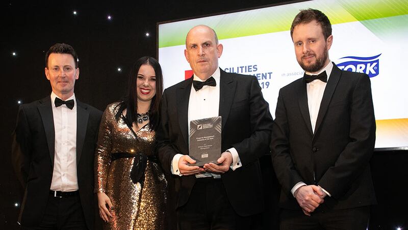 John Lawlor, CEO, Synergy Security Solutions presents the Property Management Company of the Year award to O'Dwyer Real Estate Management Team.