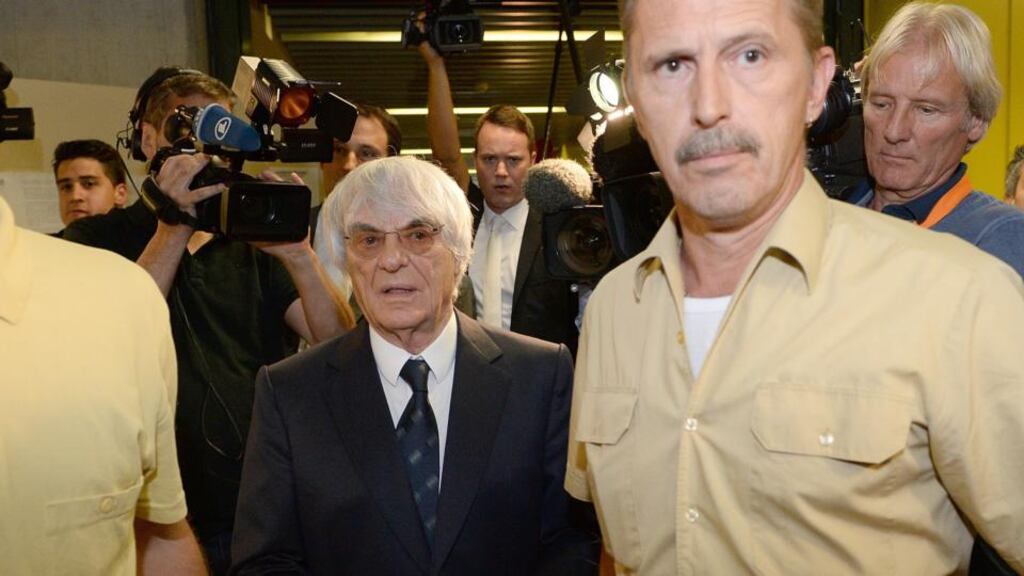Formula One chief Bernie Ecclestoneleaves the Oberlandgericht Muenchen courthouse yesterday after judges agreed to conclude his trial for bribery. Photograph: Sebastian Widmann/Getty Images