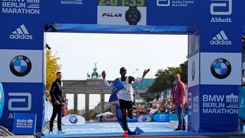 Kenya’s Eliud Kipchoge celebrates as he wins the Berlin Marathon and breaks the World Record wearing Nike Vaporfly shoes. Photograph: Fabrizio Bensch/Reuters
