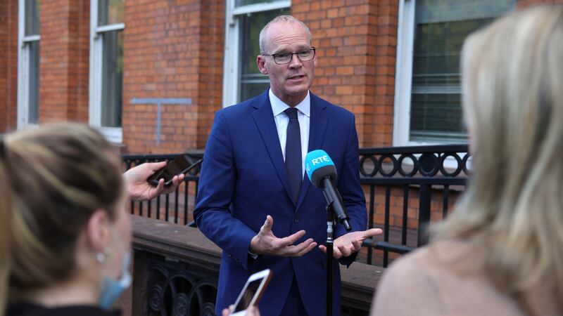 Minister for Defence Simon Coveney being  interviewed after meeting   Diane Byrne,  Karina Molloy and  Yvonne O’Rourke of the  Women of Honour group, at Iveagh House, Dublin, last month. Photograph: Dara Mac Dónaill