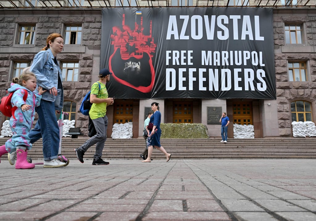 People walk past a banner on the facade of the city hall in Kyiv on June 22nd. Photograph: Sergei Supinsky/AFP via Getty Images