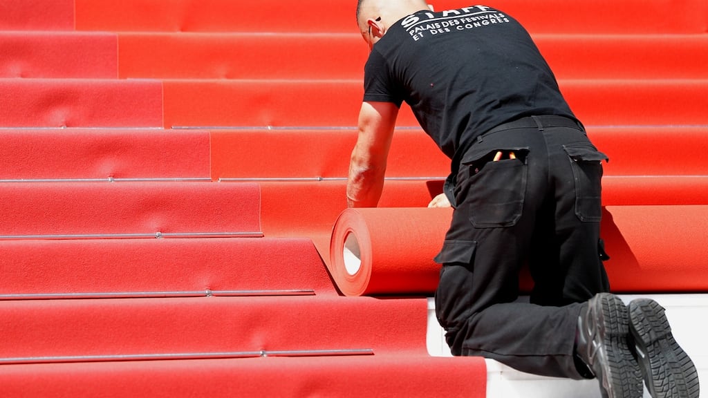 The graft behind the glitz at the Cannes Film Festival. Photograph: John Phillips/Getty Images